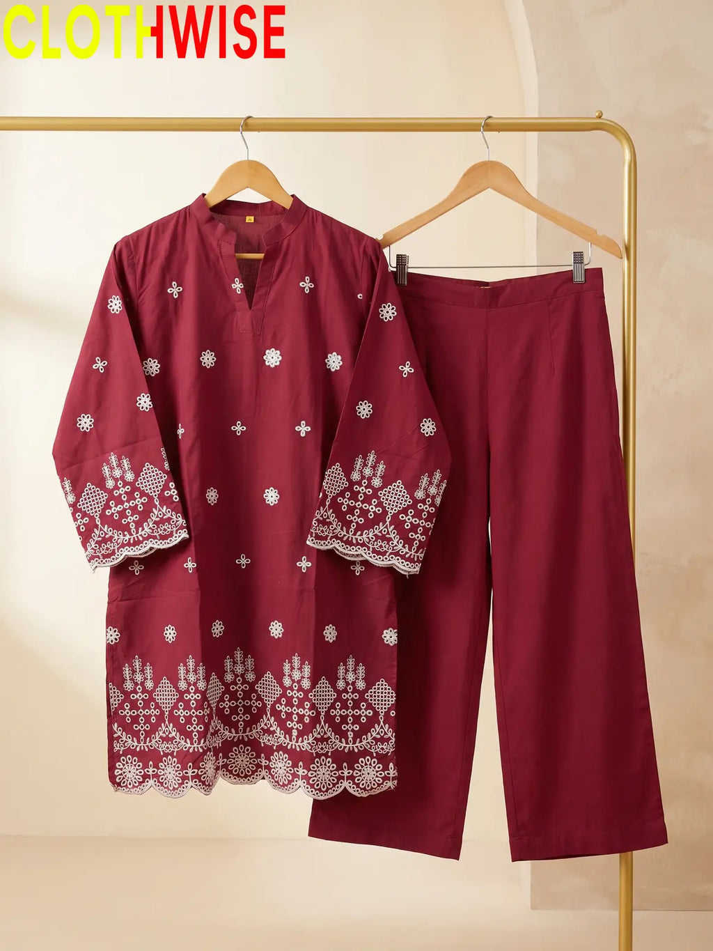 maroon colour dress hang on hanger