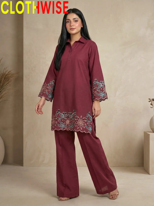 Woman wearing a maroon embroidered outfit with 'CLOTHWISE' branding.