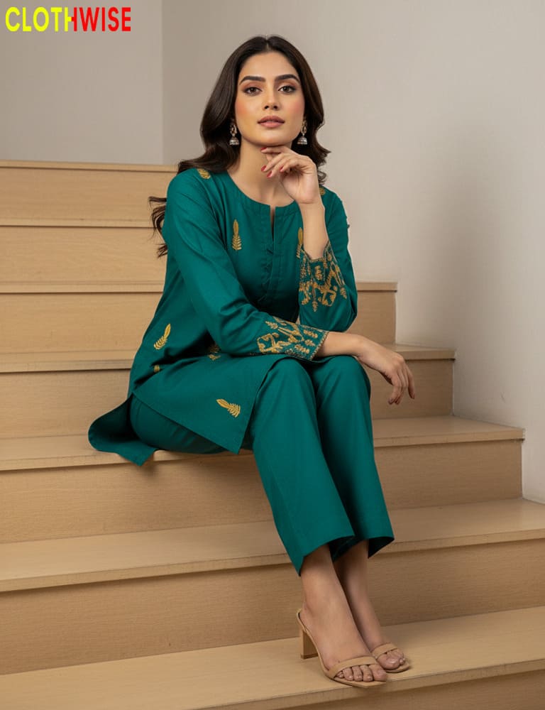 Woman in a teal outfit with gold embroidery sitting on stairs, brand 'Clothwise' visible.