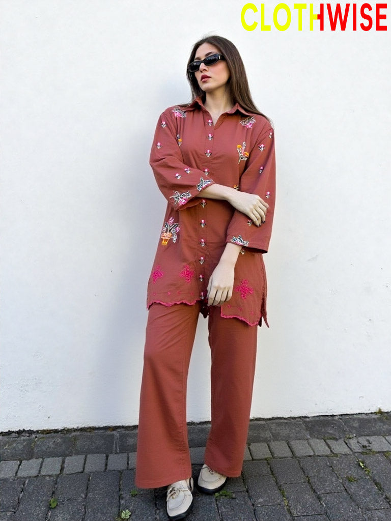 Woman wearing a rust-colored outfit with floral patterns against a white wall, branded 'ClothWise'.