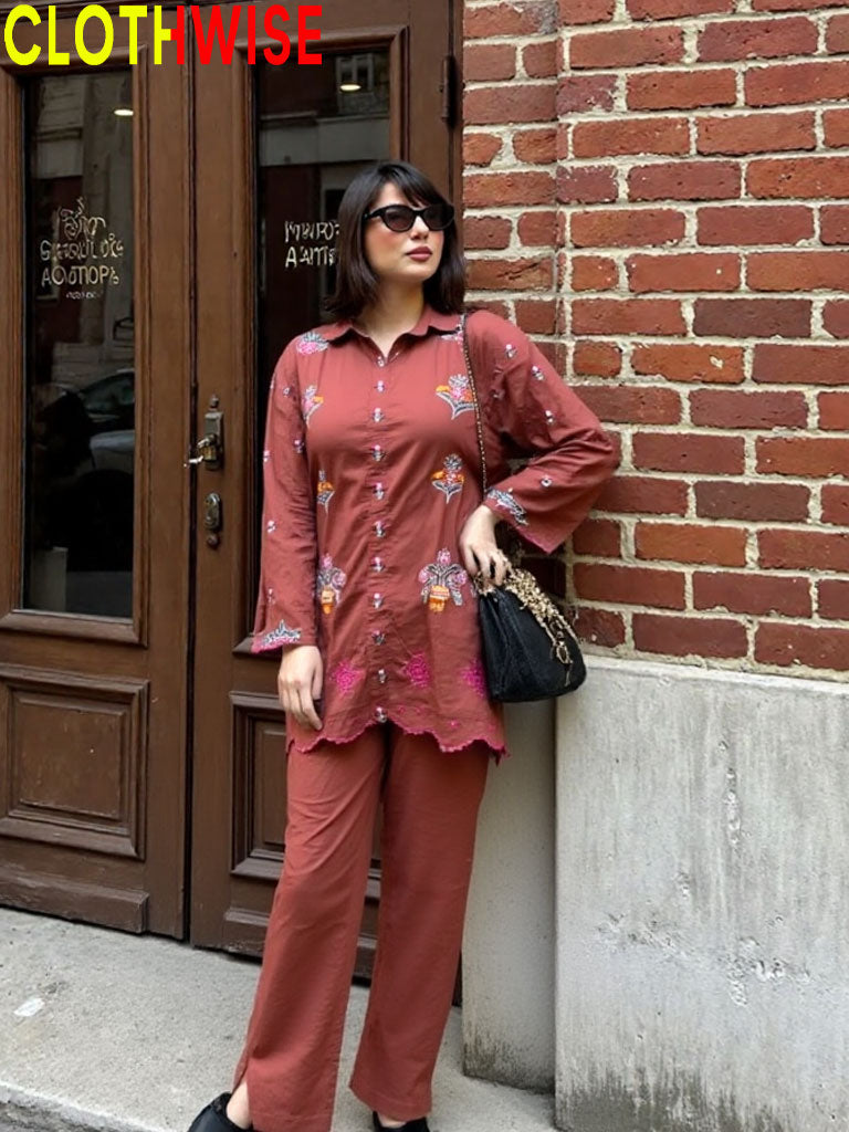 Woman in a red outfit standing against a brick wall with 'Clothwise' branding.
