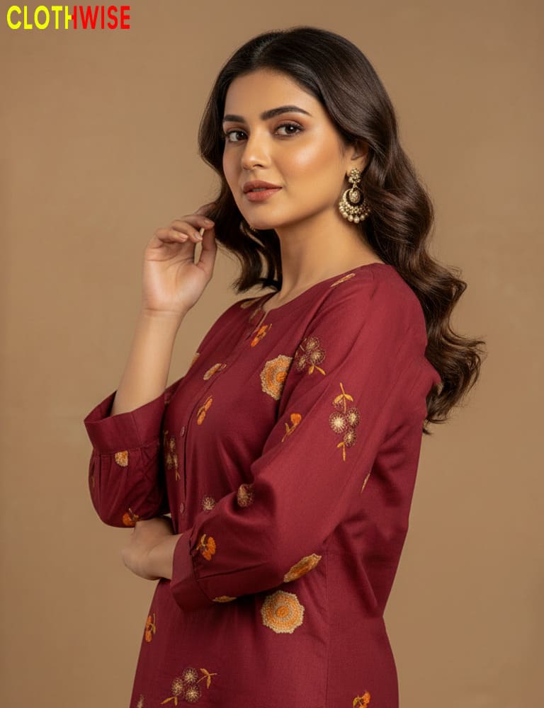 Woman wearing a maroon outfit with floral patterns against a brown background, branded 'Clothwise'.