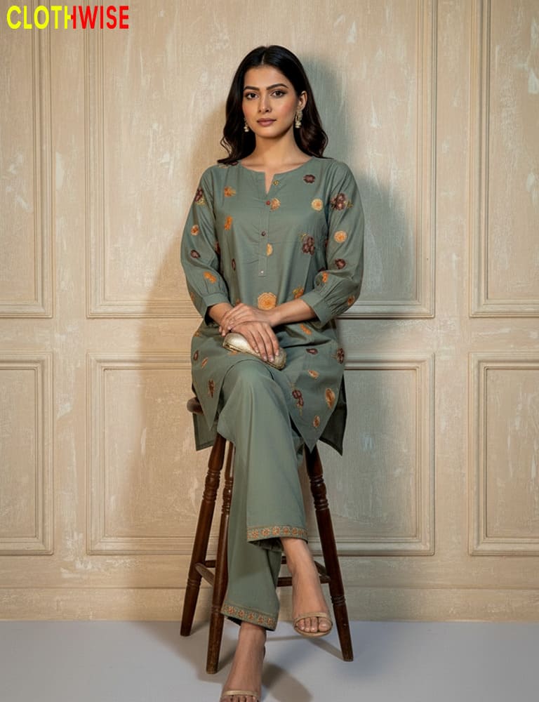 Woman in a green outfit sitting on a stool against a beige paneled wall with 'ClothWise' branding.
