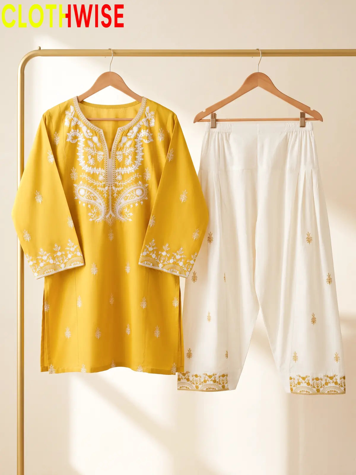 Mushq Mustard 2-piece embroidered cotton suit on hanger