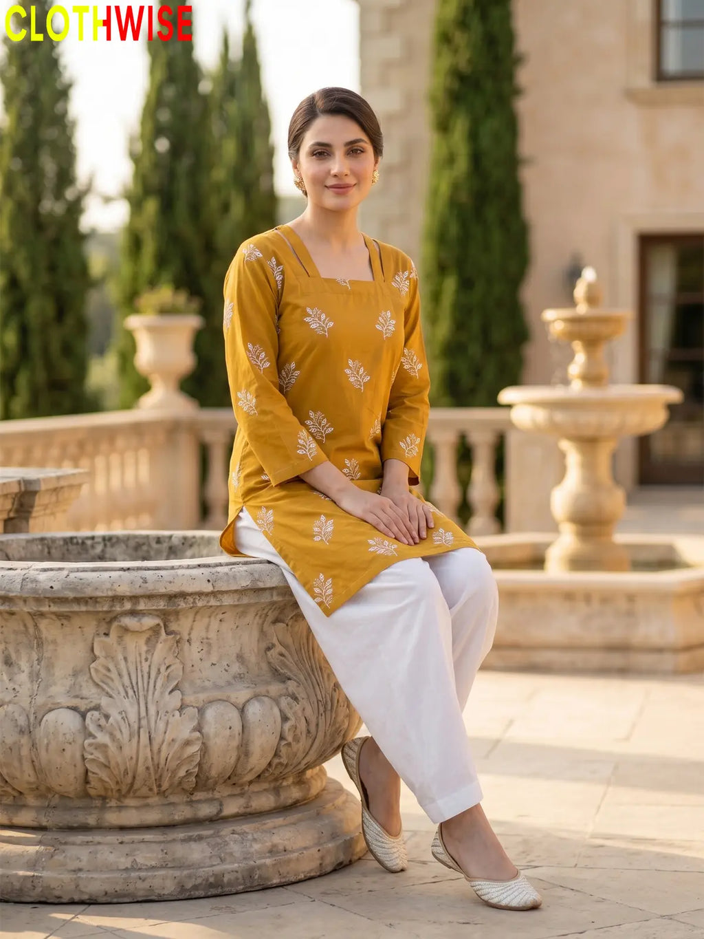 Hoor Mustard embroidered cotton suit sitting view - CLOTHWISE
