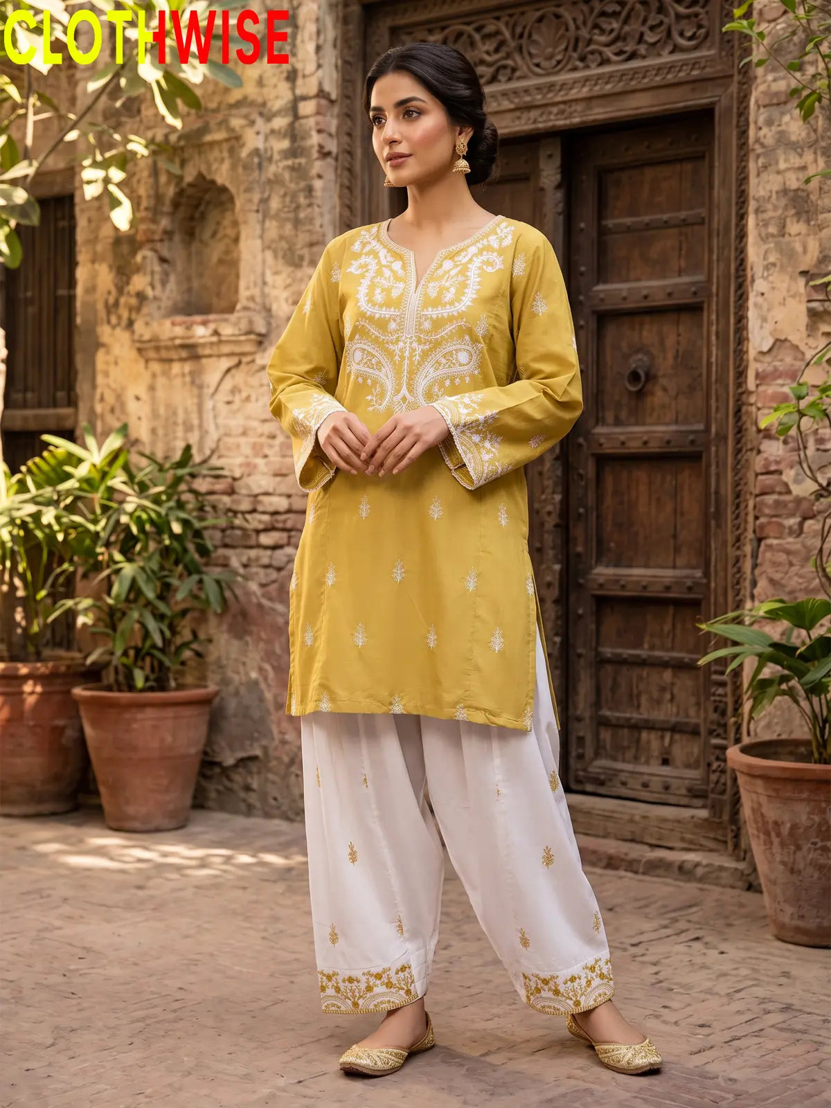 Mushq Mustard 2-piece cotton suit standing pose