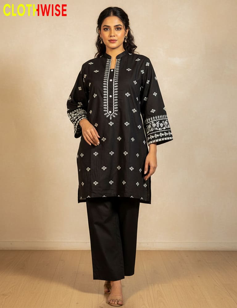 Woman wearing a black embroidered kurta with pants on a beige background, with 'ClothWise' branding.