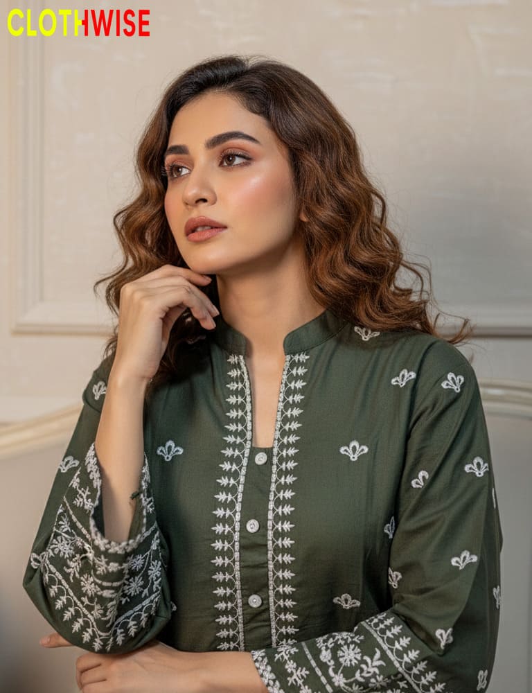 Woman wearing a green embroidered outfit with 'ClothWise' branding.