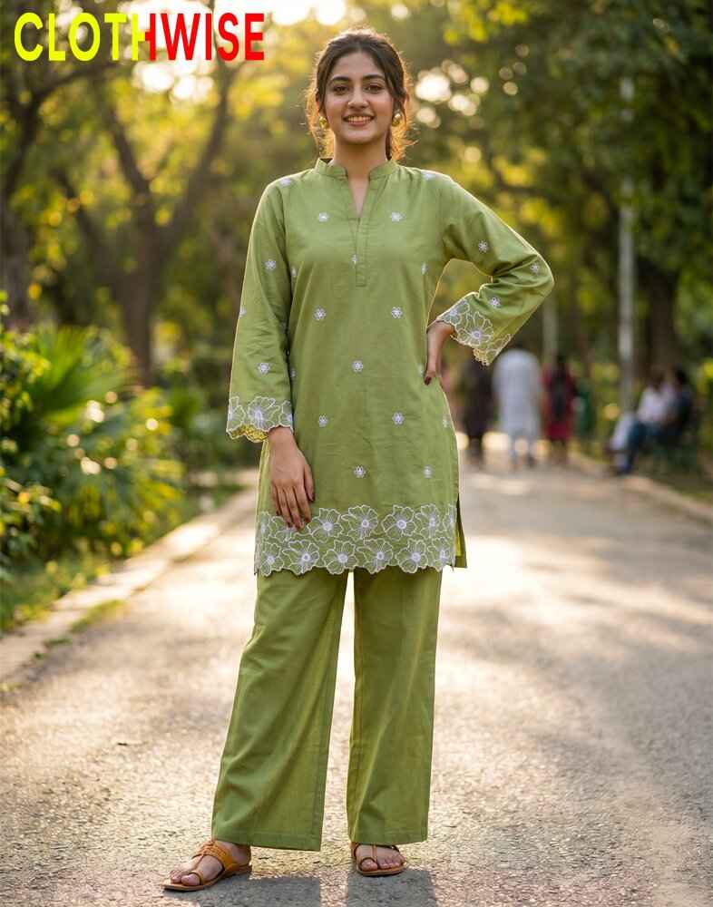 Woman wearing a green traditional outfit with 'Clothwise' branding in an outdoor setting.