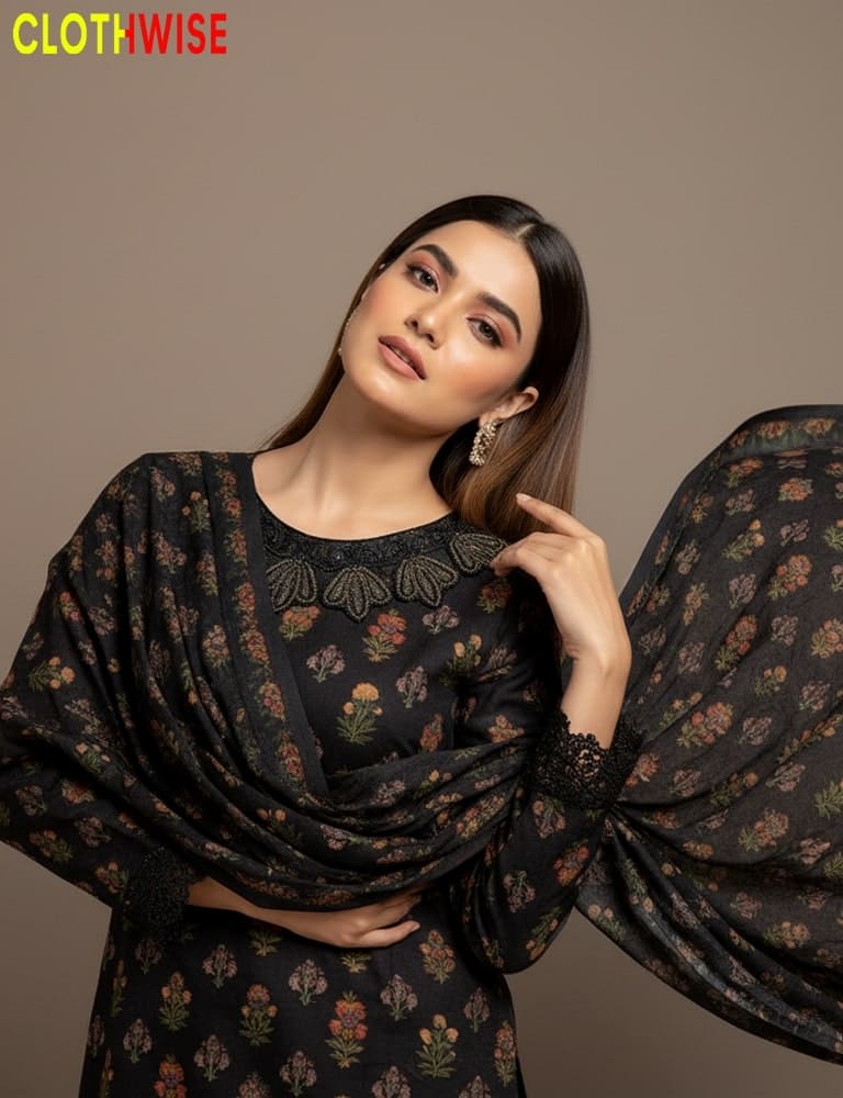 Woman wearing a black floral outfit with 'ClothWise' branding.