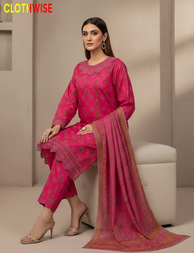 Woman wearing a pink traditional outfit with a matching dupatta, sitting on a white stool.