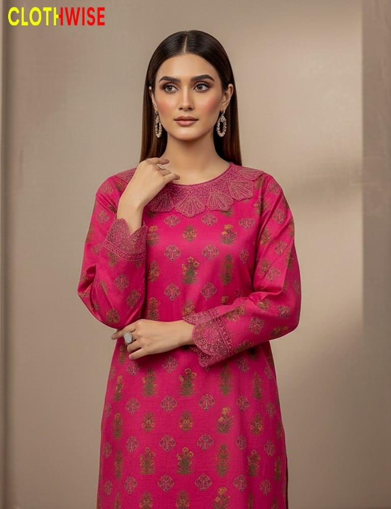 Woman wearing a pink traditional outfit with gold patterns on a beige background, branded 'Clothewise'.