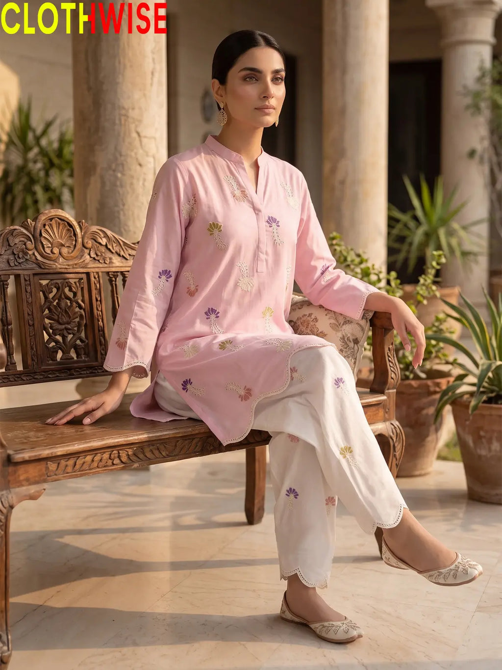 Khushi embroidered cotton suit in Pink - sitting view