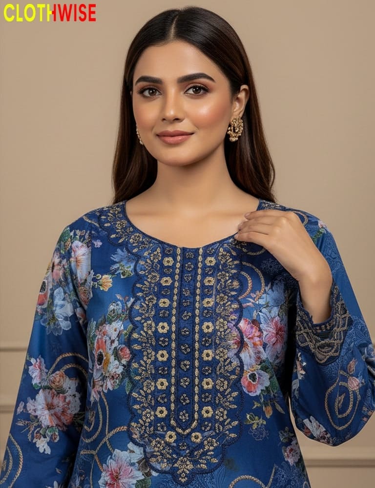 Woman wearing a blue embroidered dress with floral patterns, branded 'CLOTHWISE'.