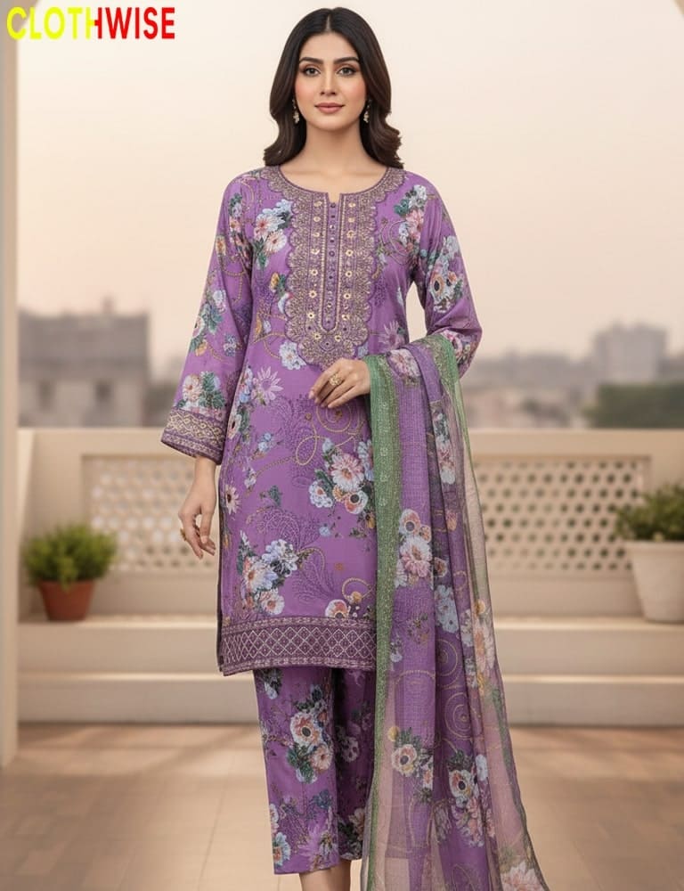 Woman wearing a purple floral dress with a matching dupatta on a rooftop with a cityscape background.