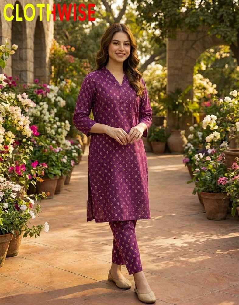 Woman in a purple outfit standing in a garden with flowers and a 'ClothWise' sign.