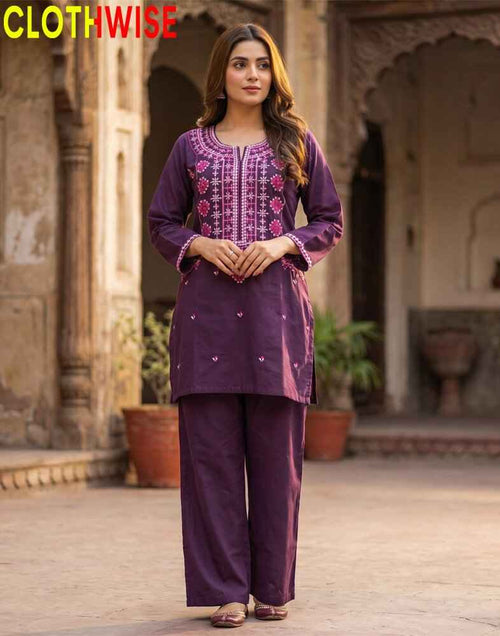 Woman wearing a purple embroidered outfit with 'CLOTHWISE' branding in the corner.