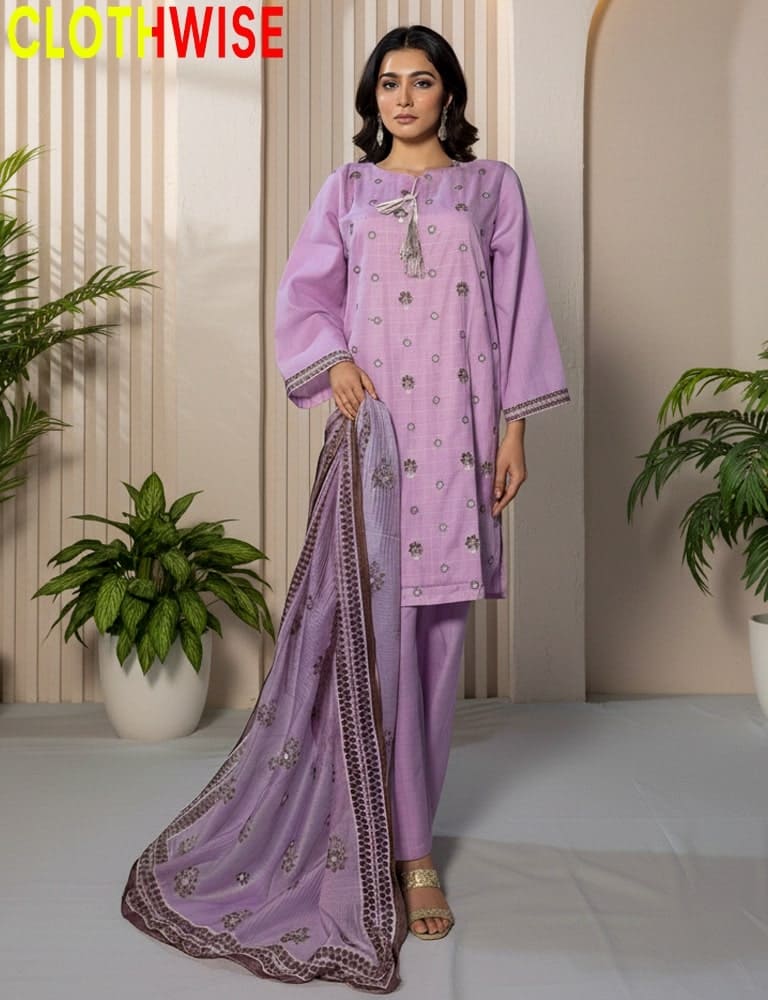 Woman wearing a purple traditional outfit with embroidery in a minimalistic setting.