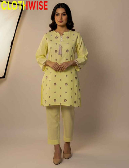 Woman wearing a light yellow kurta with pants on a beige background, with 'CLOTHWISE' branding.