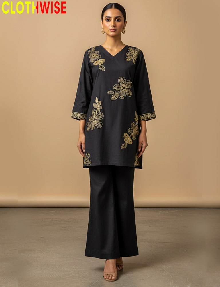 Woman wearing a black outfit with gold embroidery against a beige background, branded 'Clothwise'.