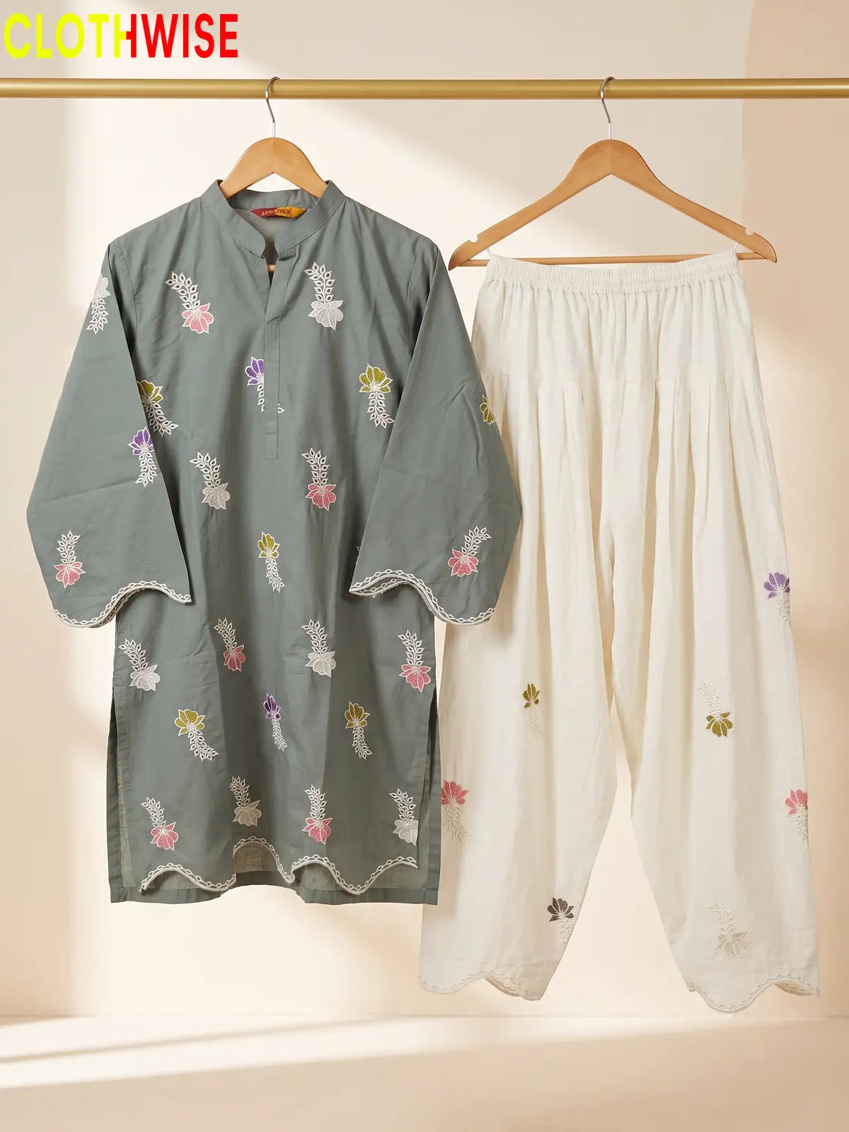 Khushi embroidered cotton suit in Sage Green - hanger view