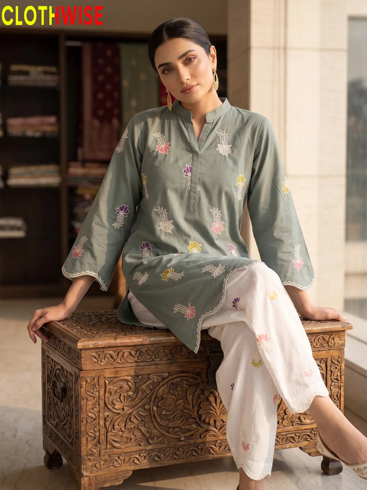 Khushi embroidered cotton suit in Sage Green - sitting view