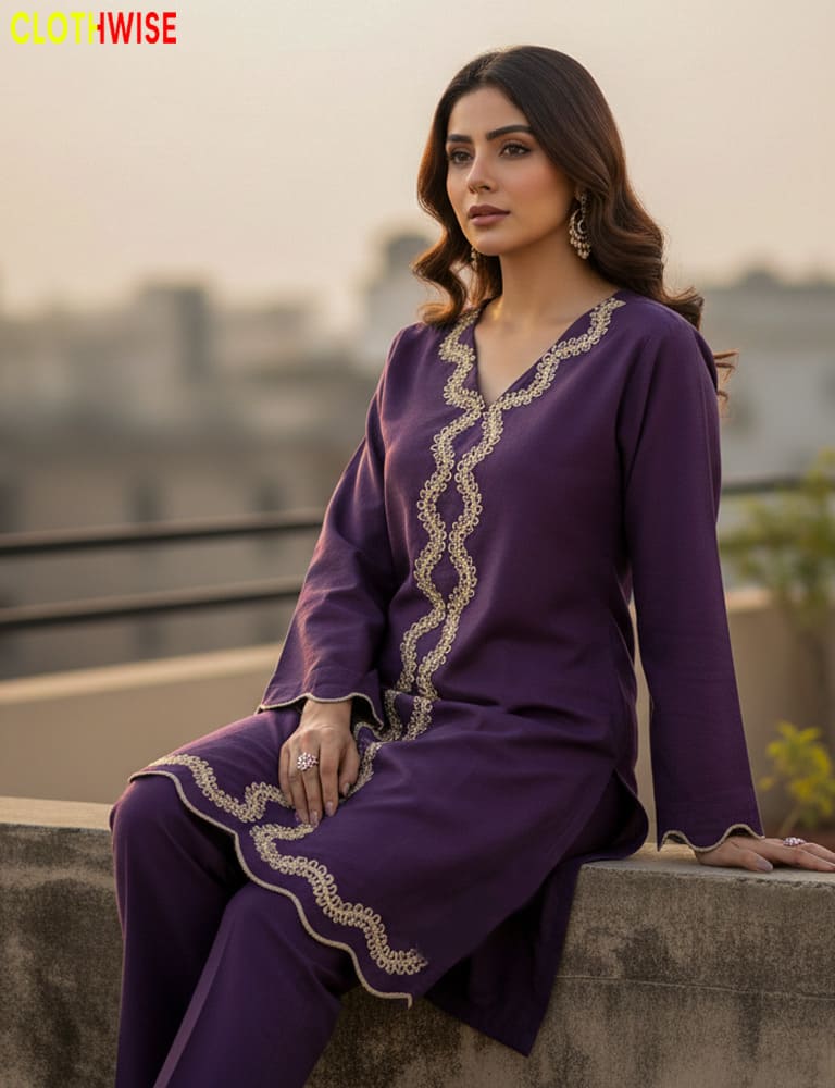 Woman in a purple outfit with gold embroidery sitting on a ledge.