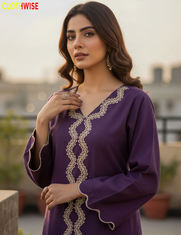 Woman wearing a purple dress with gold embroidery on a rooftop setting