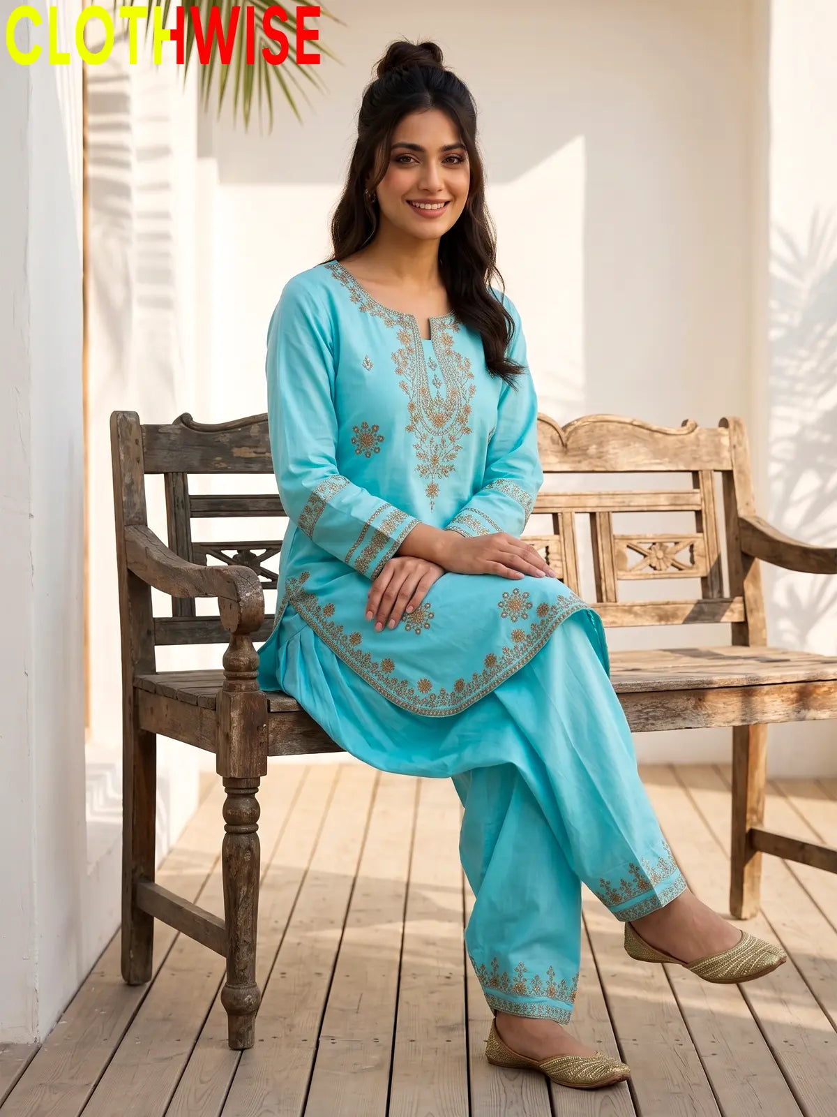 Model sitting in Armaan Sky Blue embroidered 2-piece lawn suit