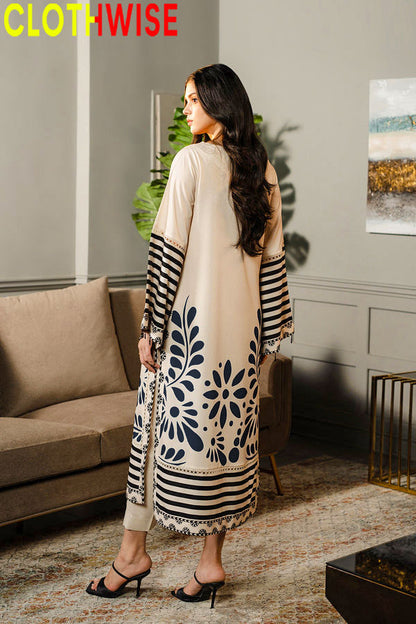 Woman wearing a long, patterned dress in a living room setting with 'CLOTHWISE' branding.