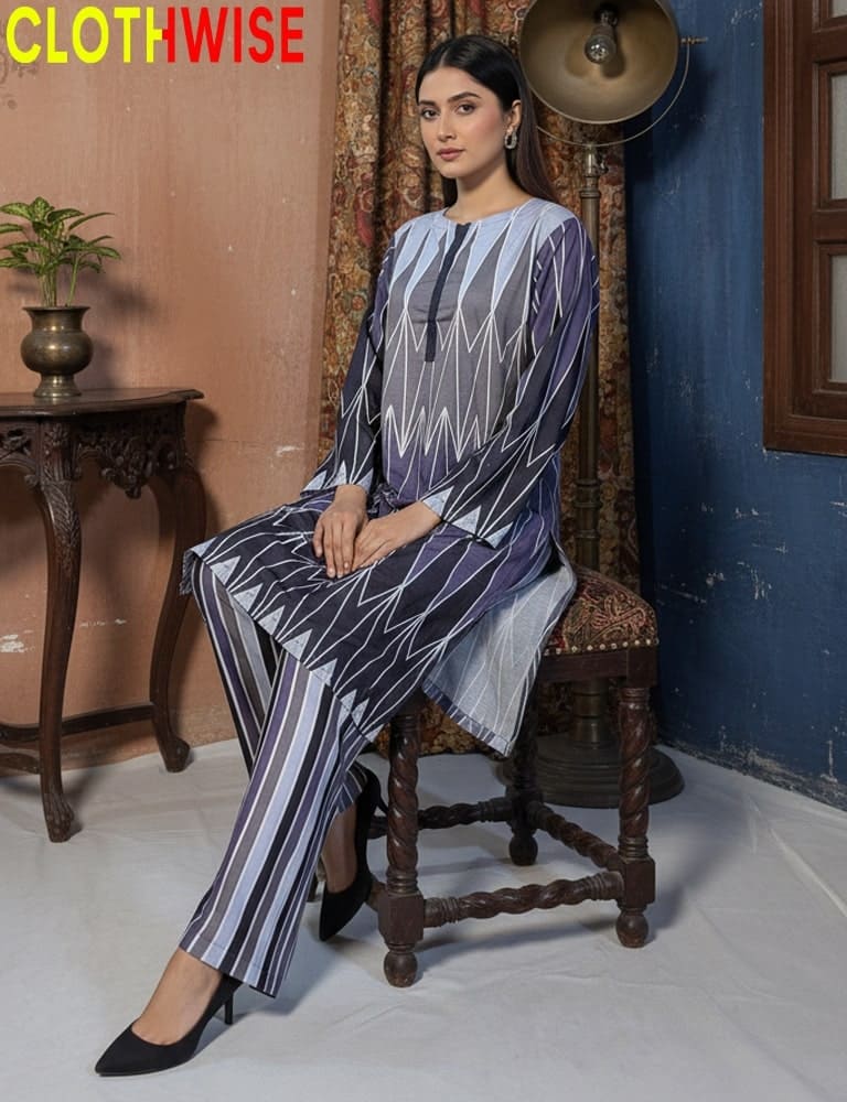 Woman sitting on a wooden chair wearing a patterned outfit with 'CLOTHWISE' branding.