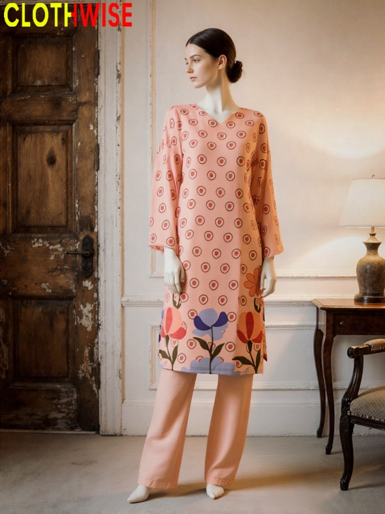 Woman wearing a patterned dress with floral design in a room with wooden door and lamp.