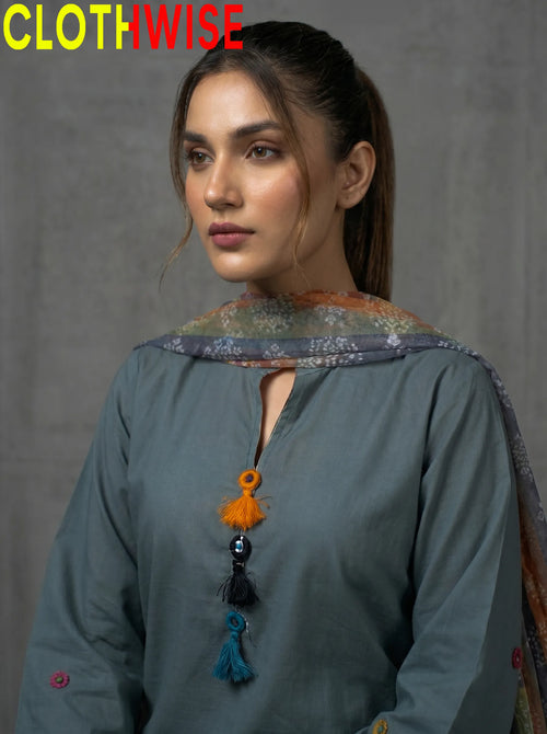 Woman wearing a traditional outfit with a gray background, featuring the brand 'Clothwise'.