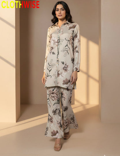 Woman wearing a floral outfit with 'CLOTHWISE' branding in the corner.