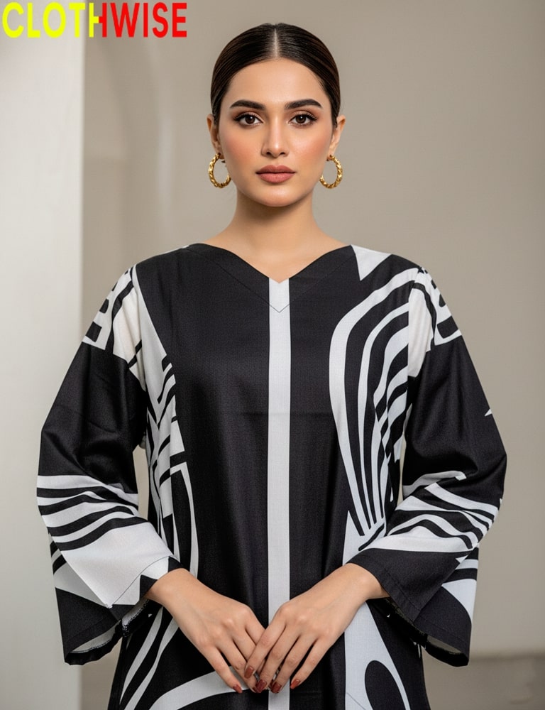 Woman wearing a black and white patterned dress with 'CLOTHWISE' branding.