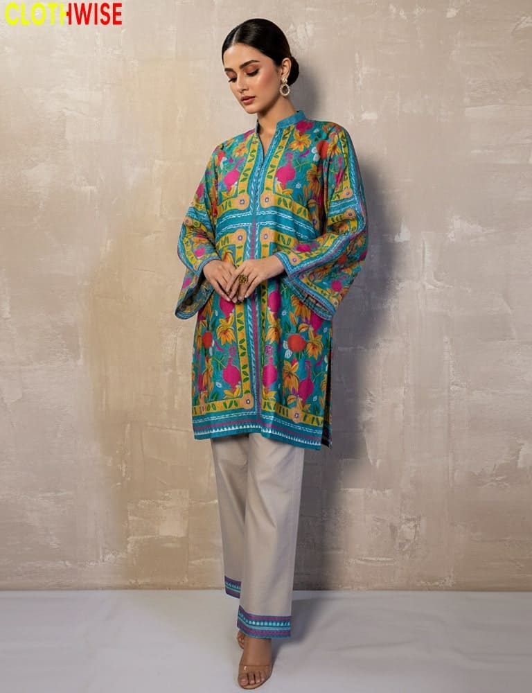 Woman wearing a colorful traditional outfit with a plain background