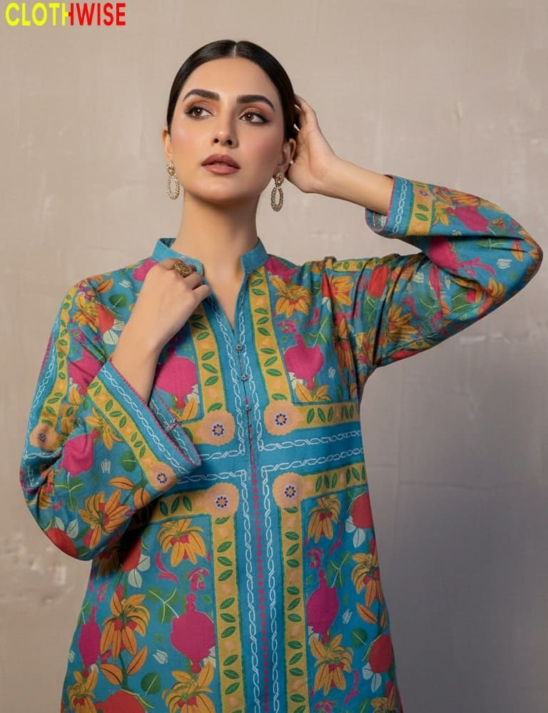 Woman wearing a colorful patterned shirt with 'Clothewise' branding.