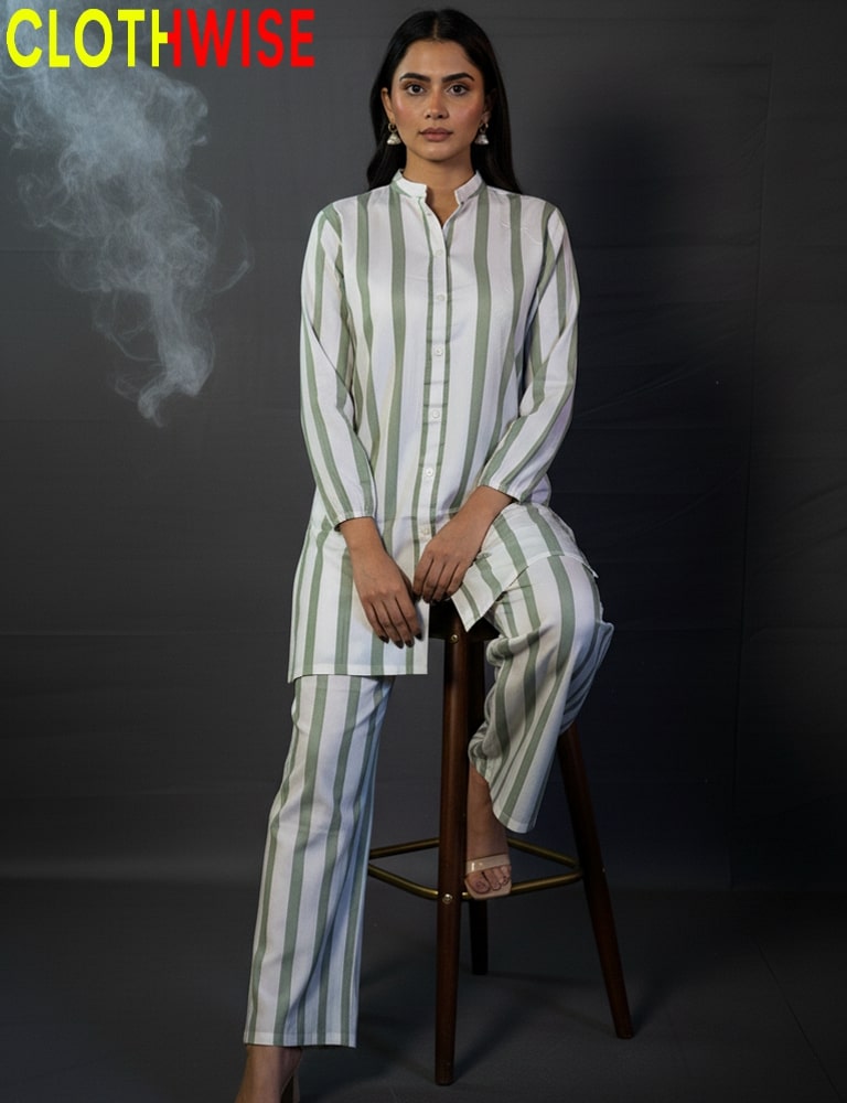 Woman wearing a striped outfit sitting on a stool with 'CLOTHWISE' branding.