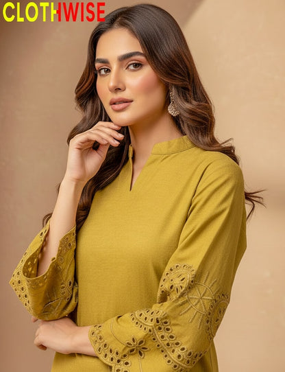 Woman wearing a mustard yellow top with intricate lace sleeves against a beige background, branded 'Clothwise'.