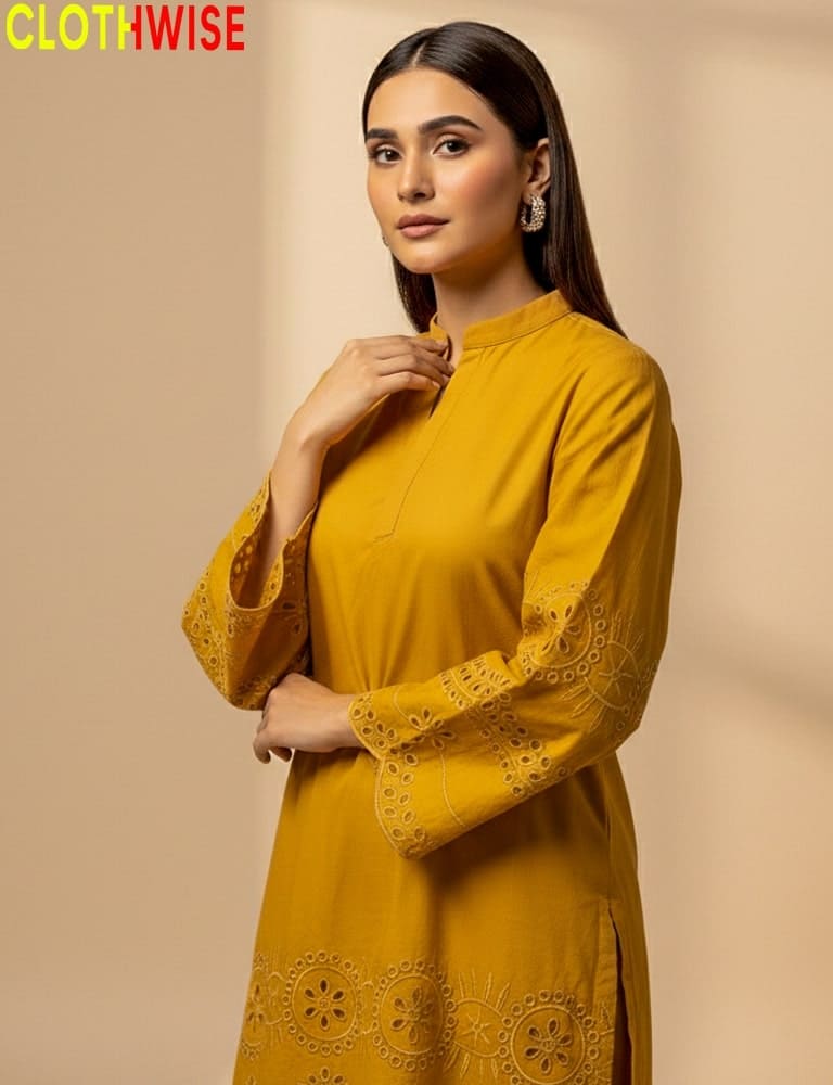 Woman wearing a mustard yellow dress with intricate designs on a beige background, branded 'Clothwise'.