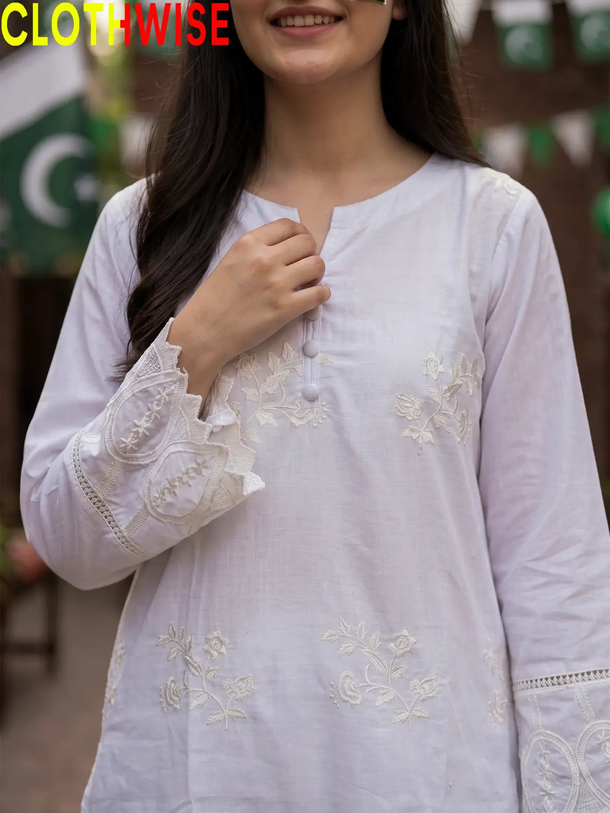 Close up of booti embroidery on Azadi White lawn suit
