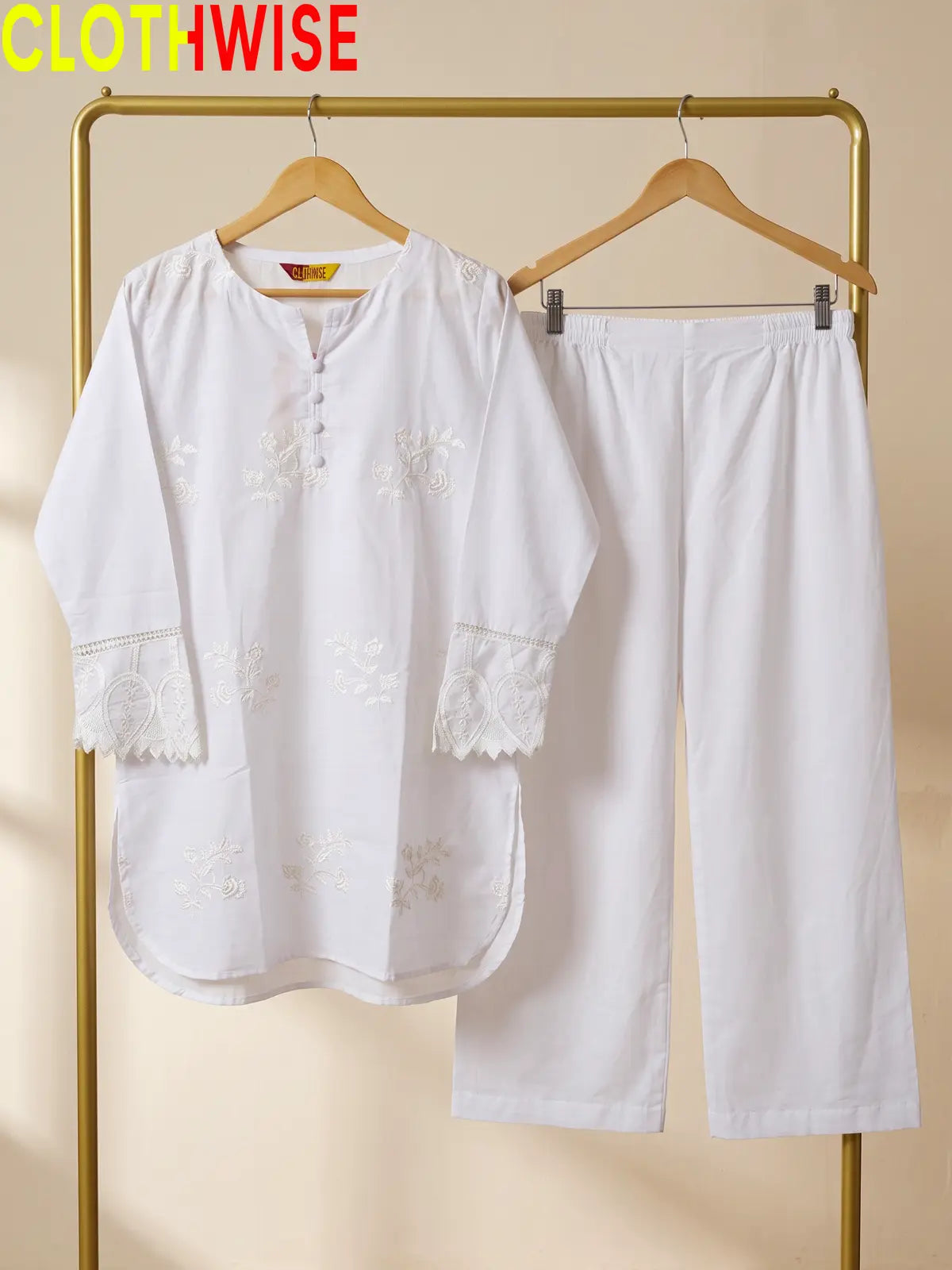 Azadi Booti Embroidered 2-piece cotton lawn suit displayed on hanger