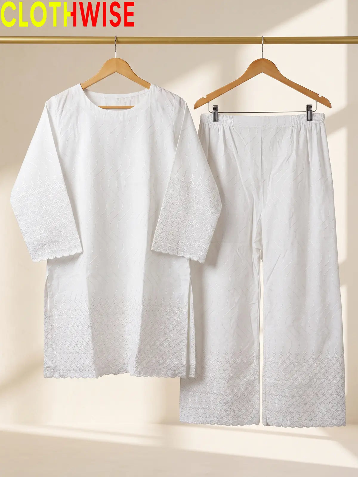 Azadi Chikankari Embroidered 2-piece cotton lawn suit displayed on hanger