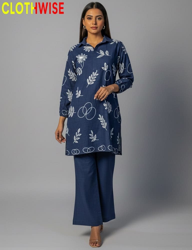 Woman wearing a navy blue outfit with white patterns on a gray background, branded 'CLOTHWISE'.