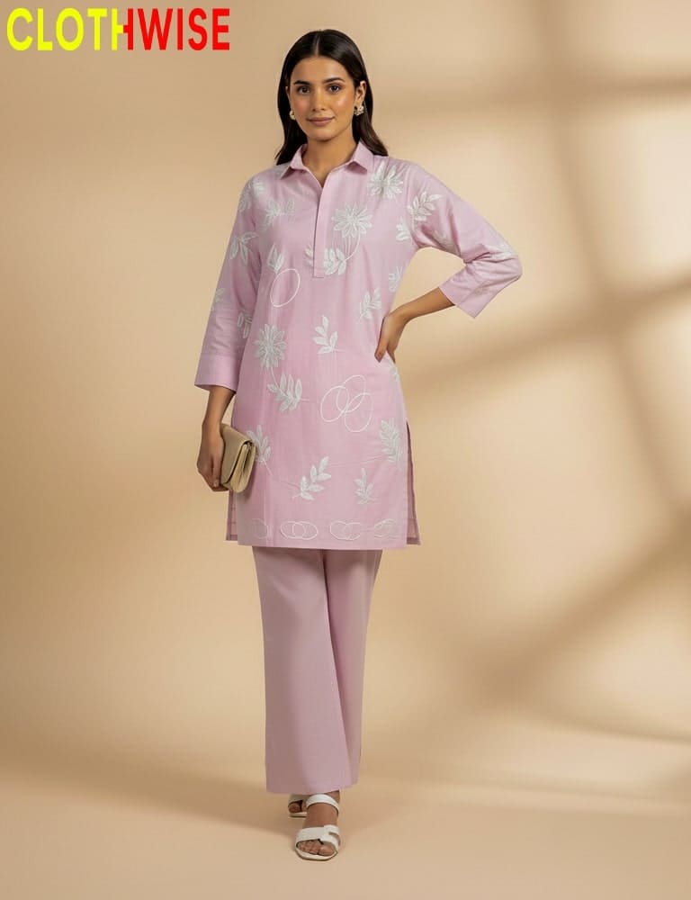 Woman wearing a pink outfit with floral patterns on a beige background, branded 'Clothwise'.