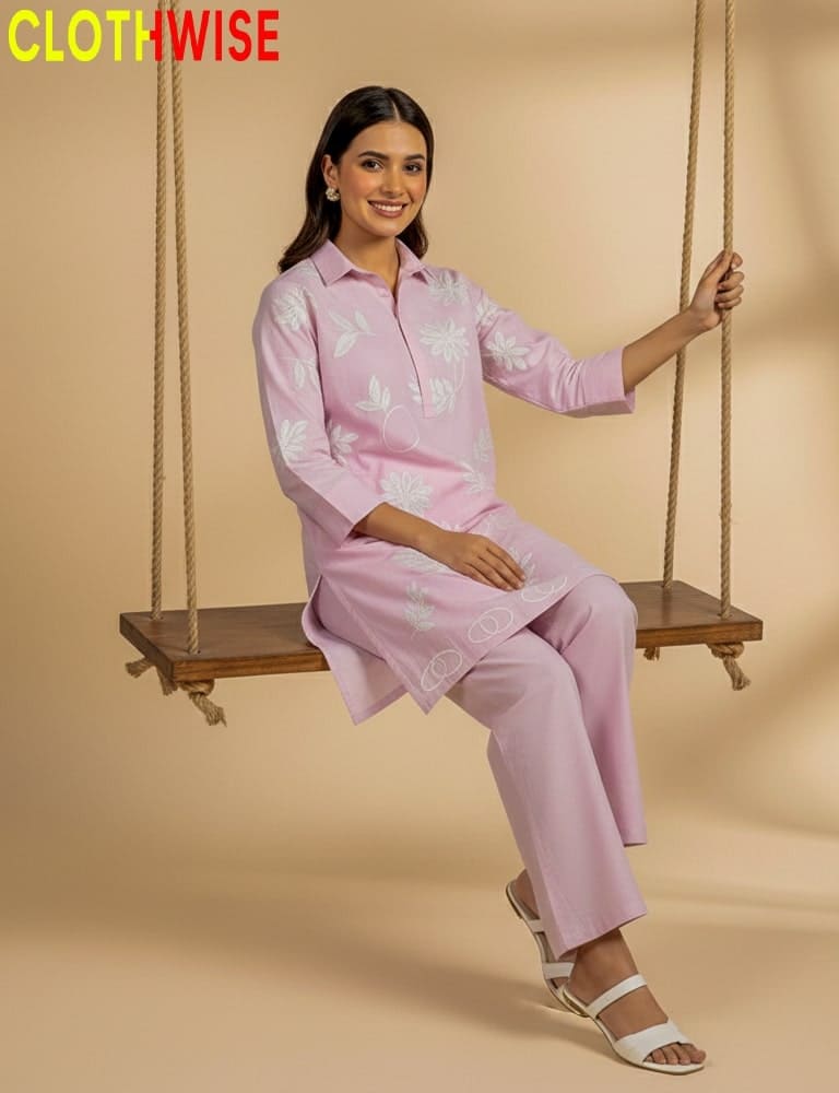 Woman in a pink outfit sitting on a swing with 'Clothwise' branding.
